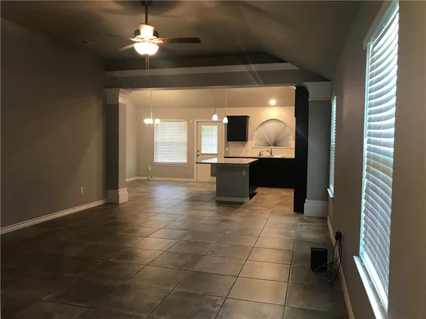 a view of a kitchen with a sink and a chandelier fire place