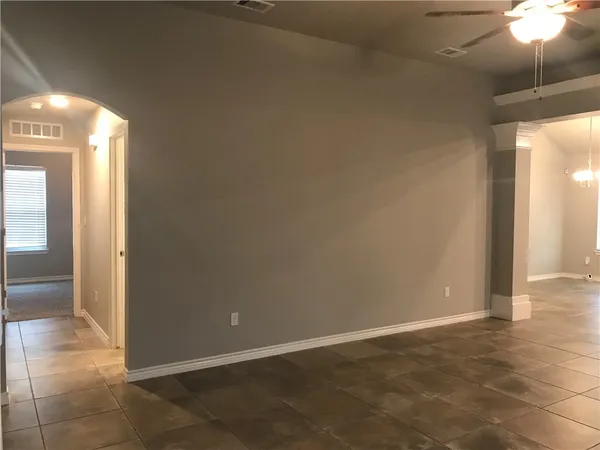 a view of a kitchen with a sink and a mirror