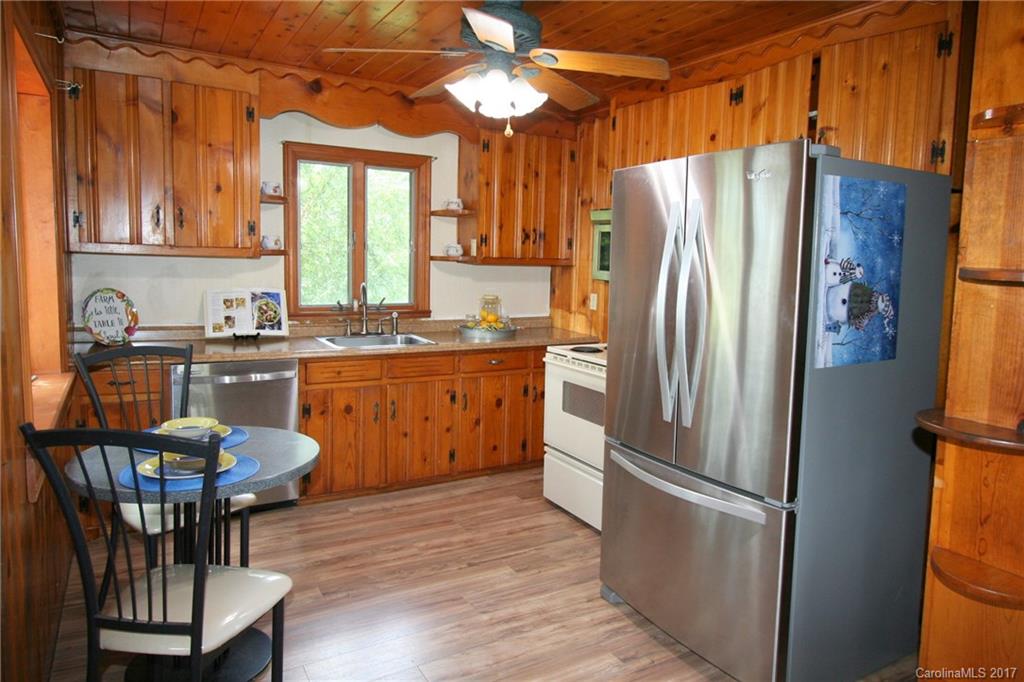1406 Tomberlin Road, Unit 6 Monroe, NC 28110 - Photo 14 of 24 a kitchen with stainless steel appliances a refrigerator a sink a stove and white cabinets