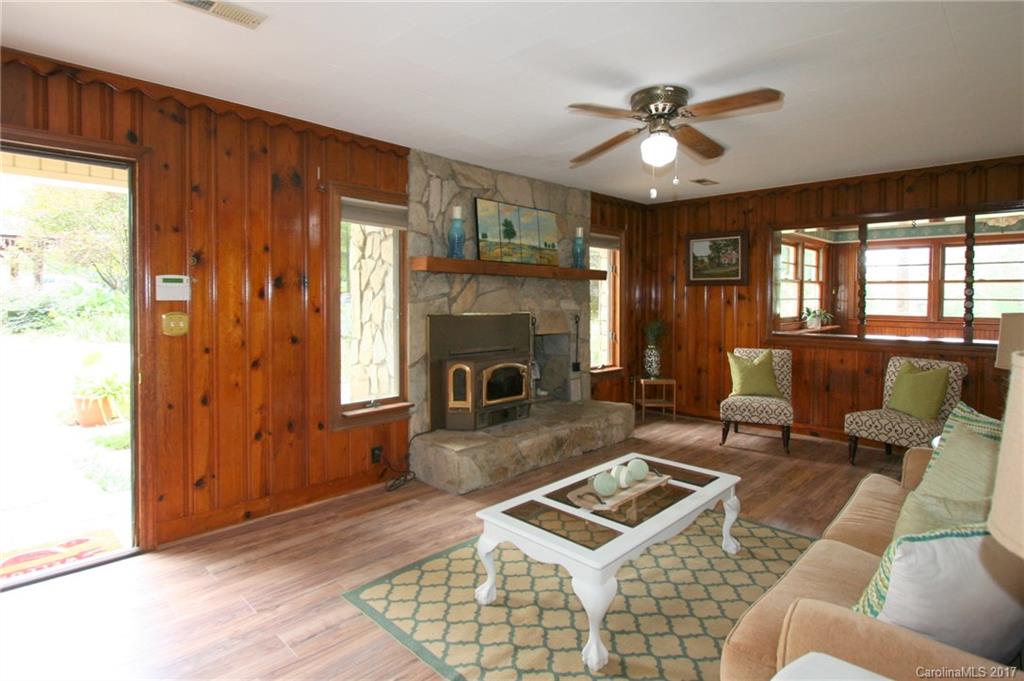 1406 Tomberlin Road, Unit 6 Monroe, NC 28110 - Photo 8 of 24 a living room with furniture a fireplace and a ceiling fan