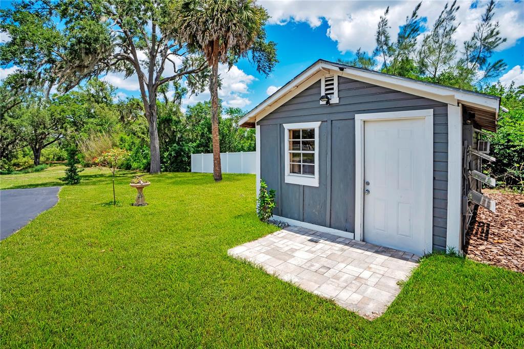 5785 Gilliam Road Orlando, FL 32818 - Photo 60 of 100 a front view of house with a garden
