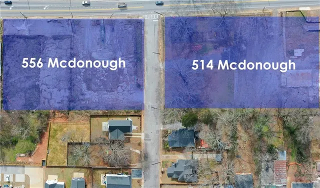 a sign that is sitting on a wooden wall