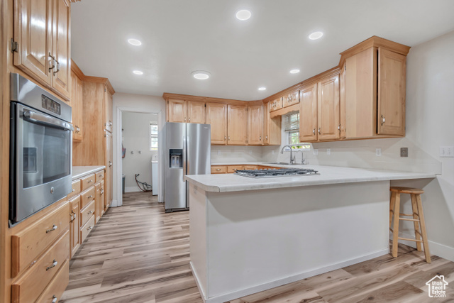 1225 North 1380th Street West Mapleton, UT 84664 - Photo 2 of 18 Kitchen with light countertops, a peninsula, recessed lighting, stainless steel appliances, and light brown cabinetry