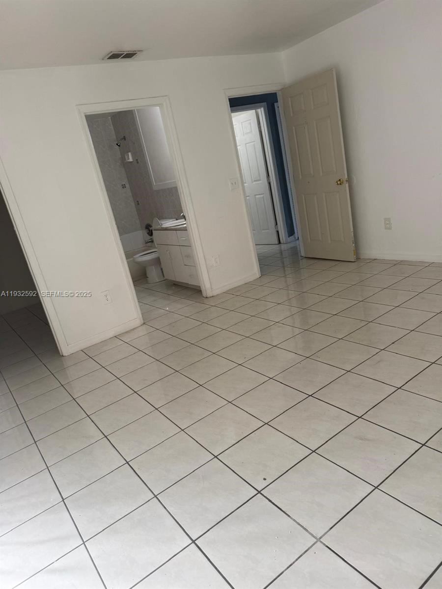 28144 Southwest 142nd Court Homestead, FL 33033 - Photo 2 of 12 a view of an empty room