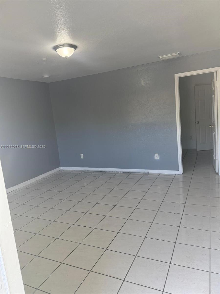 28144 Southwest 142nd Court Homestead, FL 33033 - Photo 5 of 12 a view of an empty room
