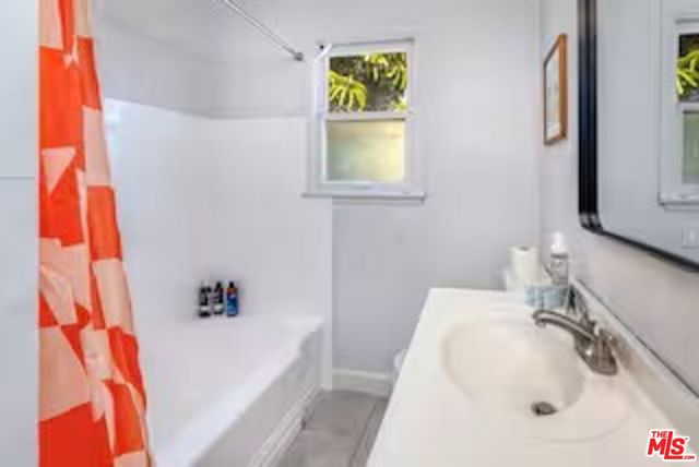 a bathroom with a sink and a bathtub
