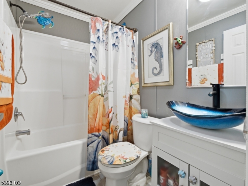 18 3rd Street Woodbridge, NJ 07001 - Photo 7 of 10 a bathroom with a toilet and a bathtub