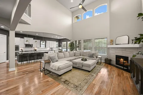 a living room with furniture and a fireplace