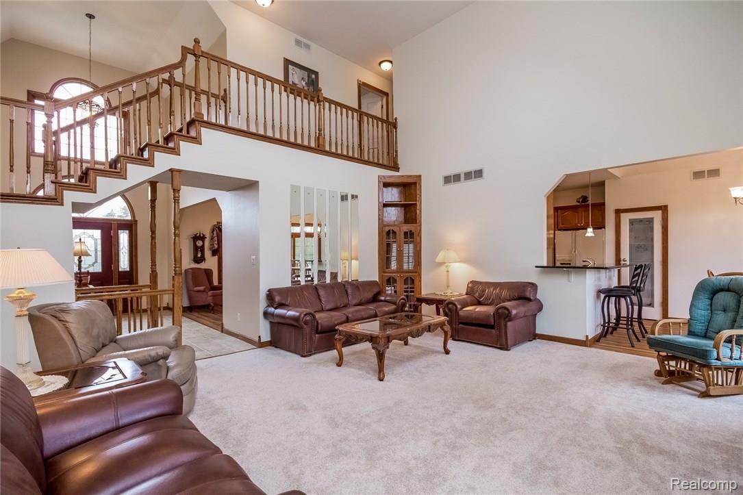23835 Elwell Road Belleville, MI 48111 - Photo 5 of 78 TWO STORY GREAT ROOM OPEN TO KITCHEN AND FOYER