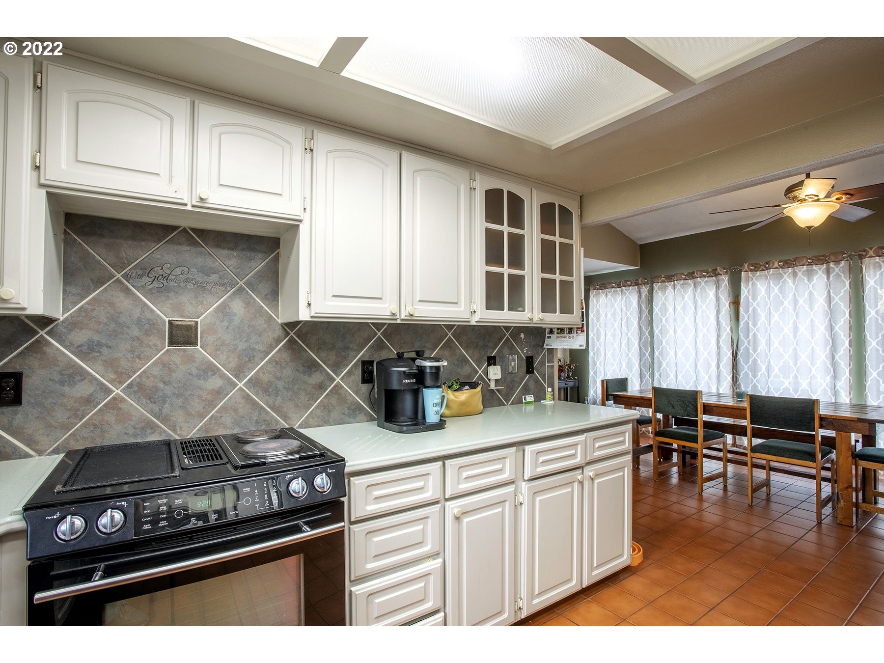 968 South 55th Place Springfield, OR 97478 - Photo 11 of 32 a kitchen with a stove and cabinets