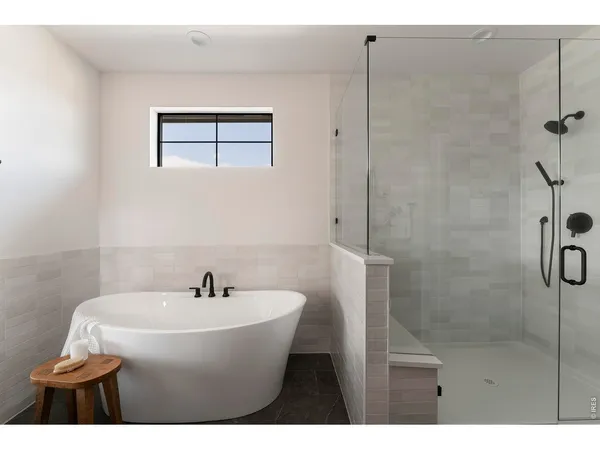 a bathroom with a sink a window and a mirror