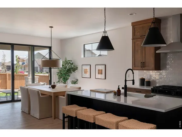 a kitchen with a sink cabinets and window