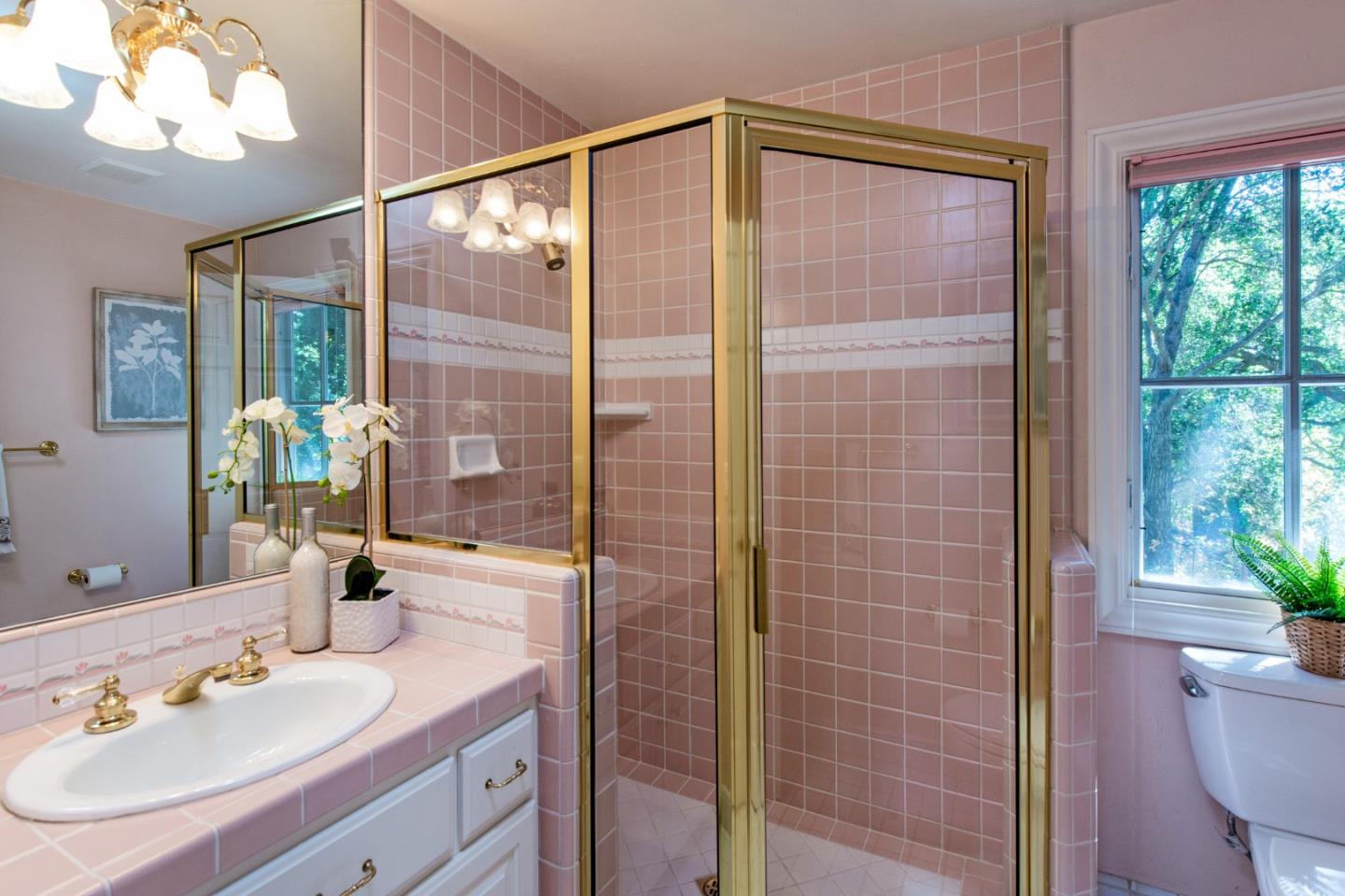 18540 Bicknell Road Monte Sereno, CA 95030 - Photo 34 of 51 a bathroom with a granite countertop sink a toilet and shower