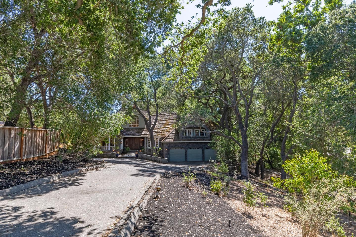 18540 Bicknell Road Monte Sereno, CA 95030 - Photo 4 of 51 a front view of a house with a yard and tree