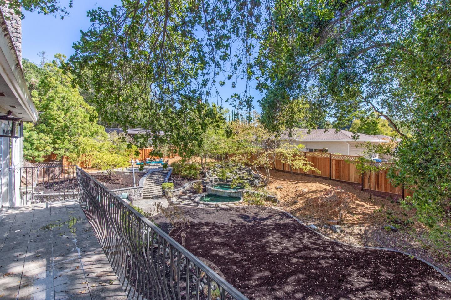 18540 Bicknell Road Monte Sereno, CA 95030 - Photo 46 of 51 a view of a house with a tree in the yard