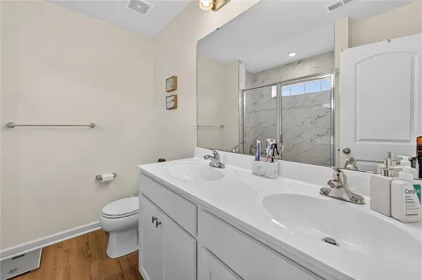 a bathroom with a sink toilet and vanity