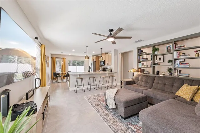 a living room with furniture and a large window