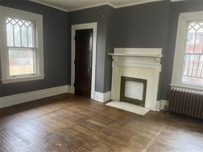 71 North Euclid Avenue, Unit 3 Pittsburgh, PA 15202 - Photo 13 of 18 an empty room with windows and fireplace
