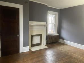 71 North Euclid Avenue, Unit 3 Pittsburgh, PA 15202 - Photo 15 of 18 a view of an empty room with wooden floor and a window