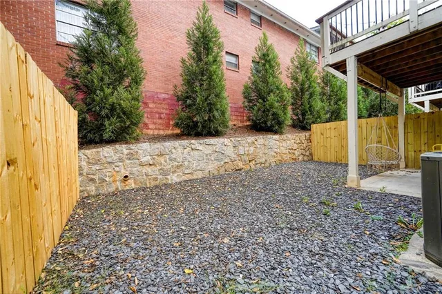 a view of a backyard of the house