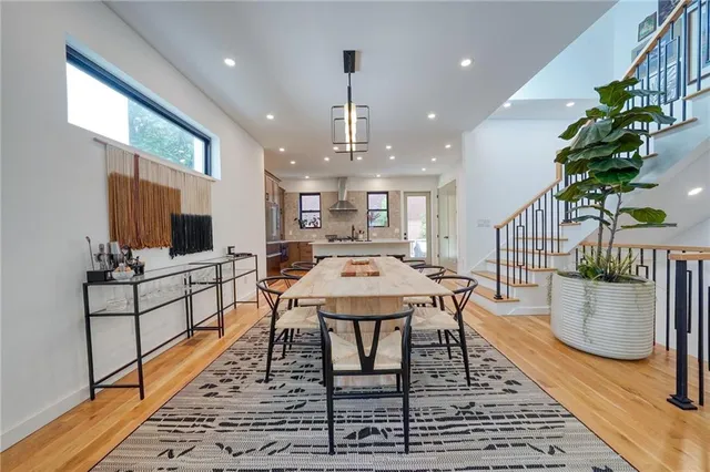 a large kitchen with a table and chairs in it