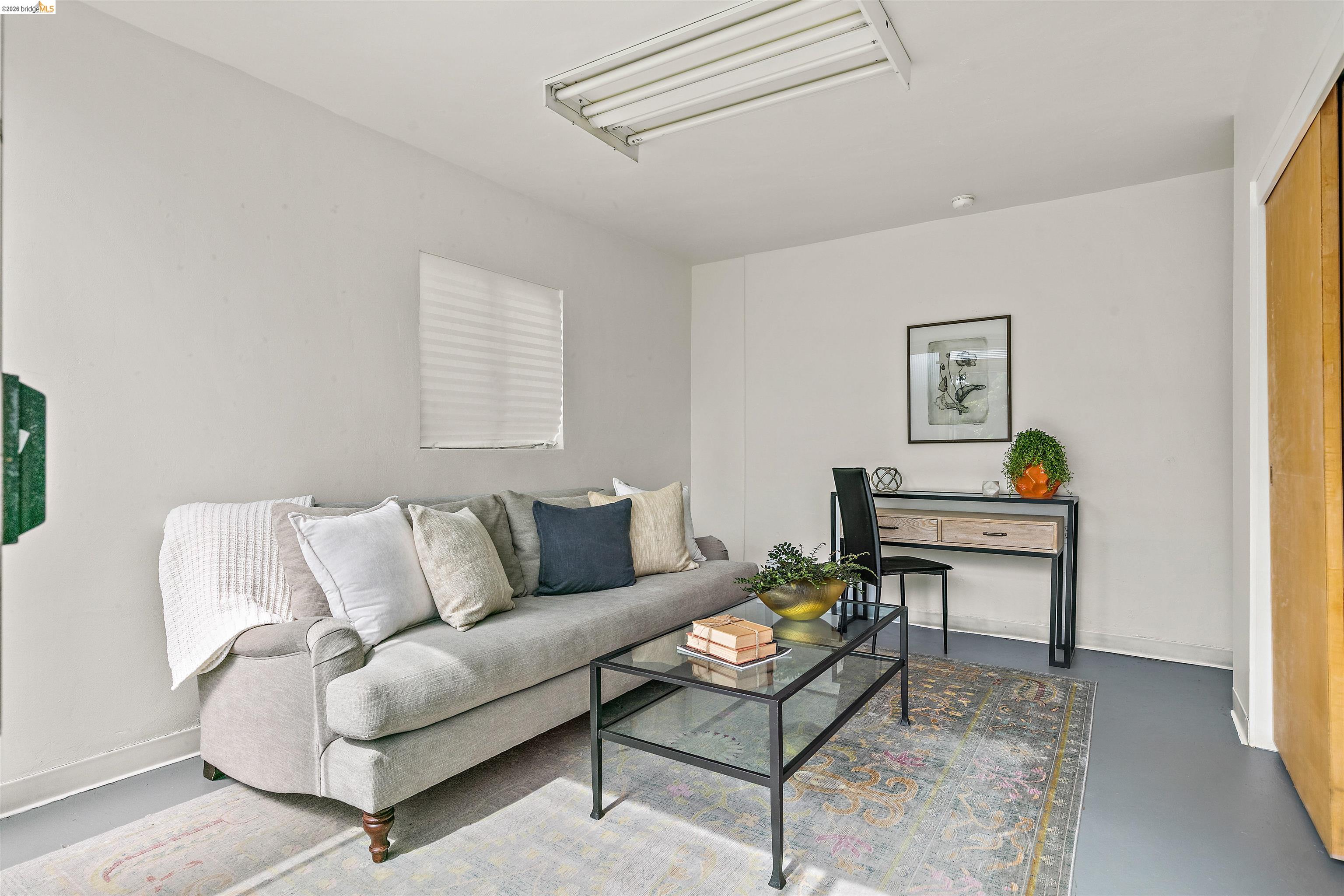 910 Pierce Street Albany, CA 94706 - Photo 19 of 44 a living room with furniture and a painting on the wall