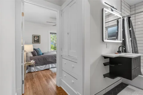 a en suite bathroom with a toilet sink and mirror