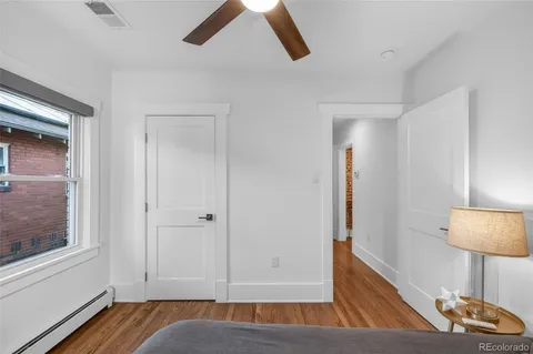 a view of room with window and wooden floor
