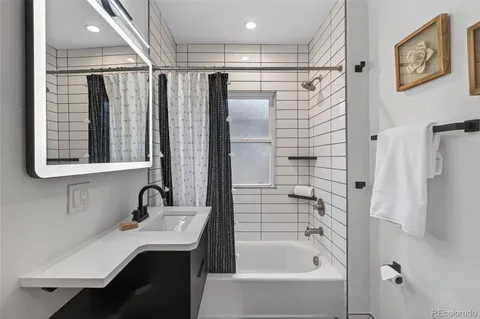 a bathroom with a sink and a bathtub