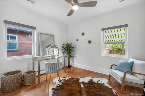 a bedroom with furniture and a window