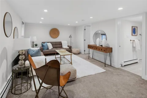a living room with furniture and a table