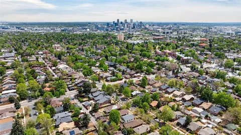 an aerial view of residential house and car parked
