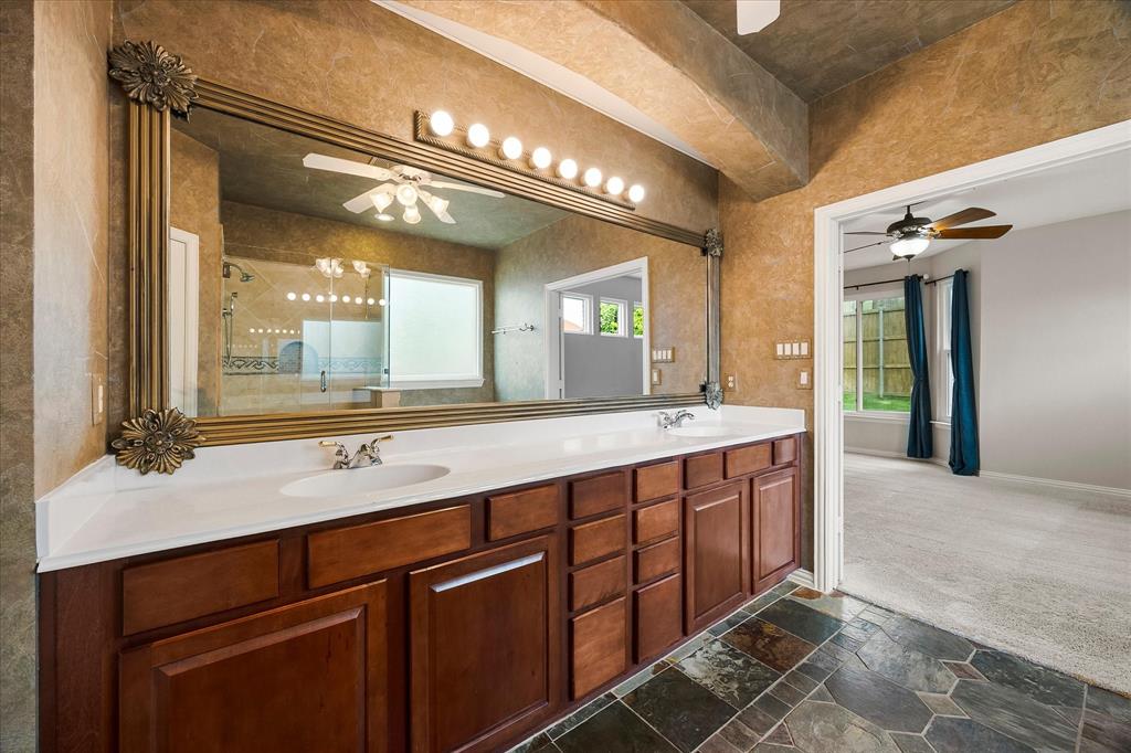 645 Channel Ridge Drive Rockwall, TX 75087 - Photo 19 of 40 The long vanity offers lots of storage and counterspace.