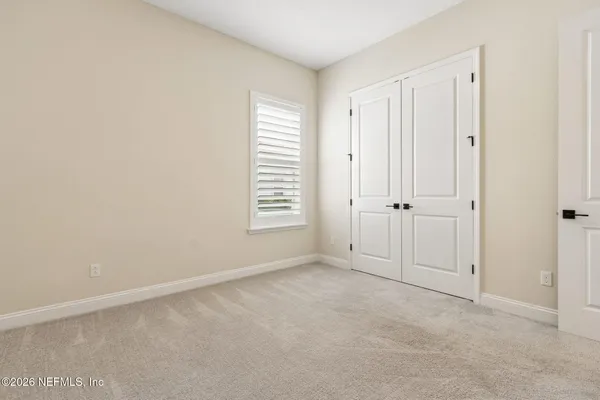a view of kitchen with wooden floor and electronic appliances
