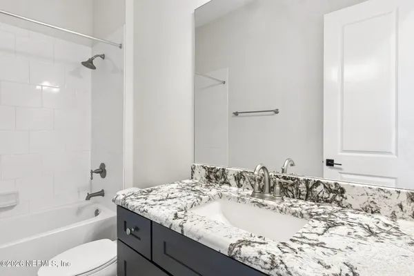 a view of a livingroom with wooden floor