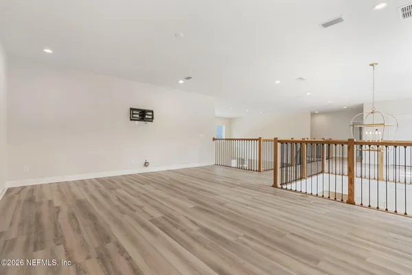a white bath tub sitting next to a white toilet and sink