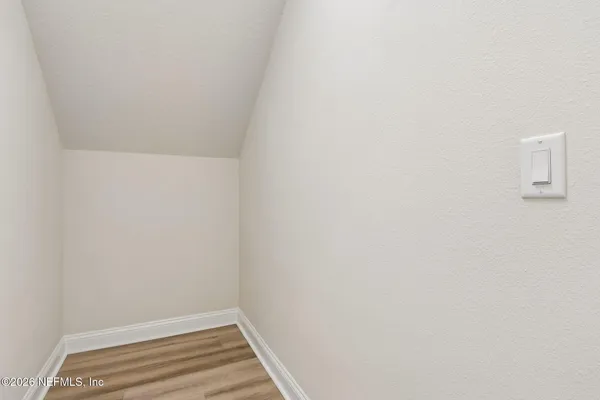 an aerial view of residential houses with outdoor space and swimming pool