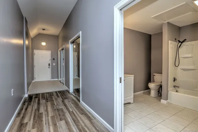 a view of a bathroom with a tub and shower