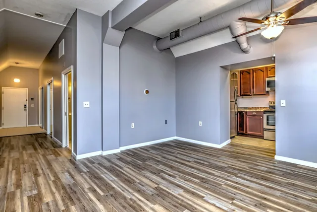 a view of a room with wooden floor and staircase
