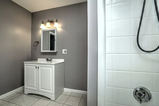 a bathroom with a sink and a mirror