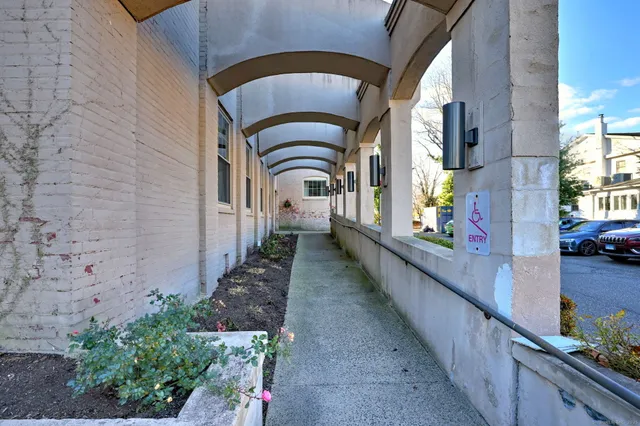 a view of entryway with flower pots