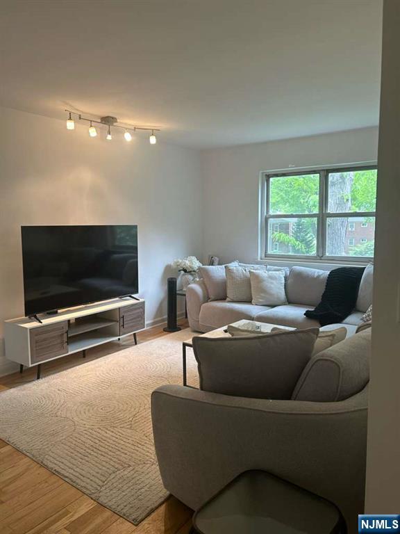 1480 Terrace, Unit 4 Teaneck, NJ 07666 - Photo 2 of 14 a living room with furniture and a flat screen tv