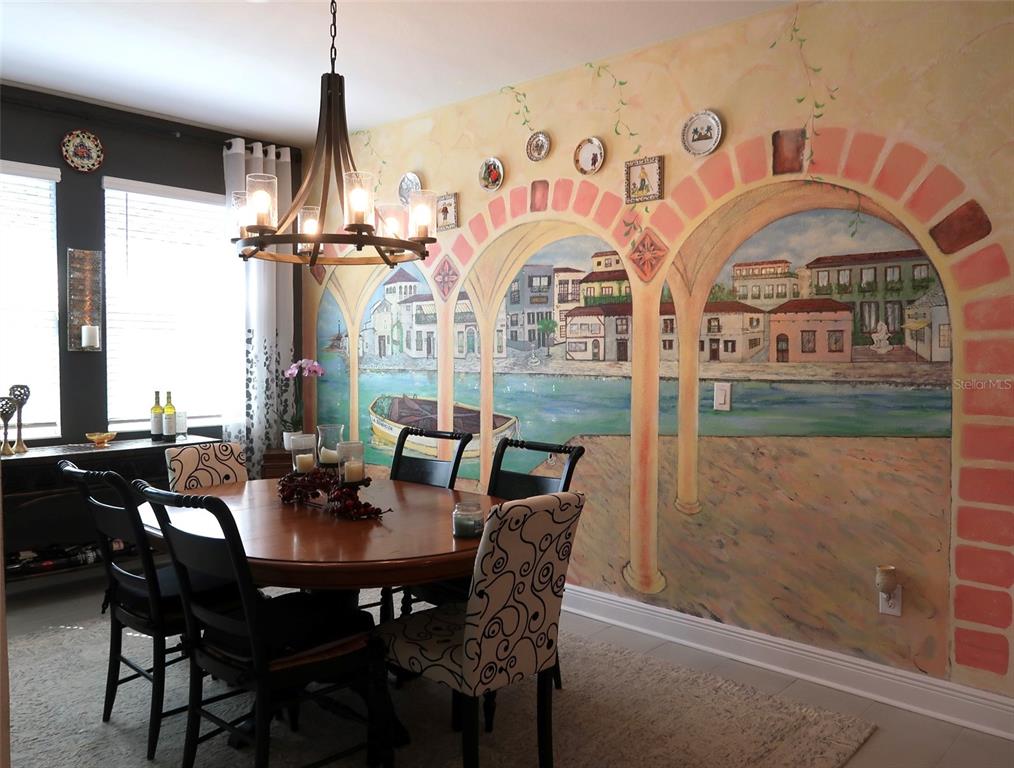 2535 Fireflag Lane Sarasota, FL 34232 - Photo 11 of 17 a view of a dining room with furniture
