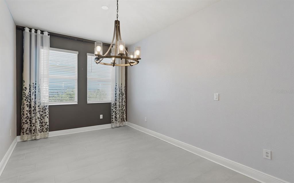 2535 Fireflag Lane Sarasota, FL 34232 - Photo 11 of 27 a view of an empty room with a window