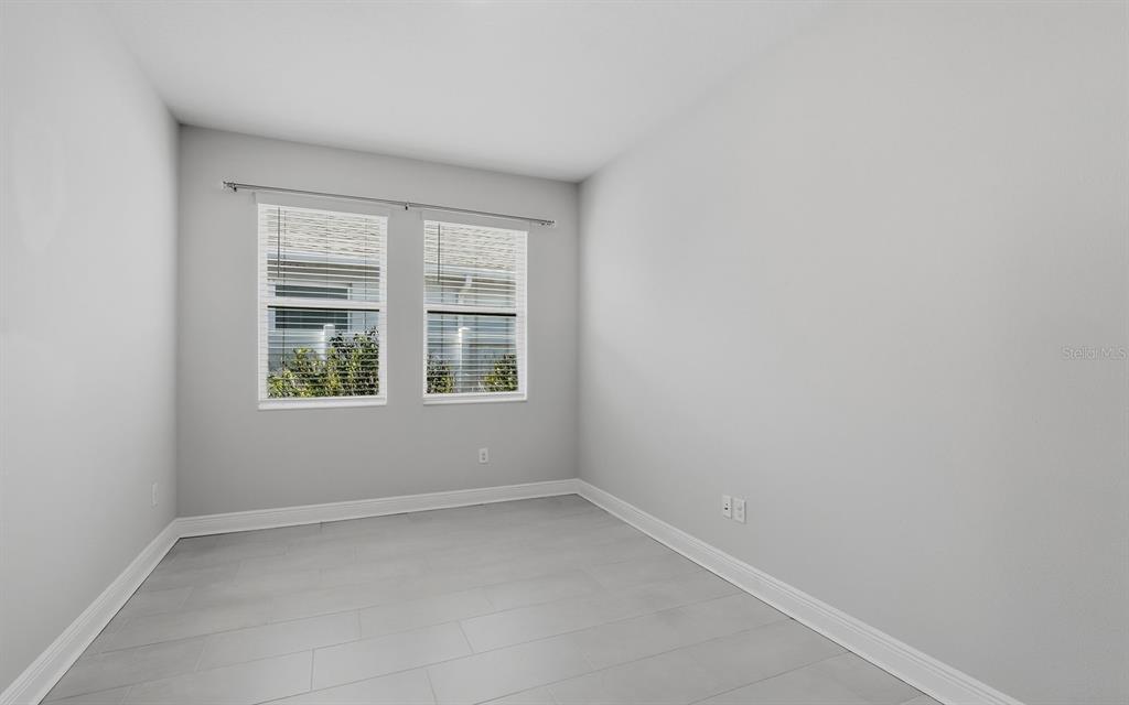 2535 Fireflag Lane Sarasota, FL 34232 - Photo 14 of 27 an empty room with a window