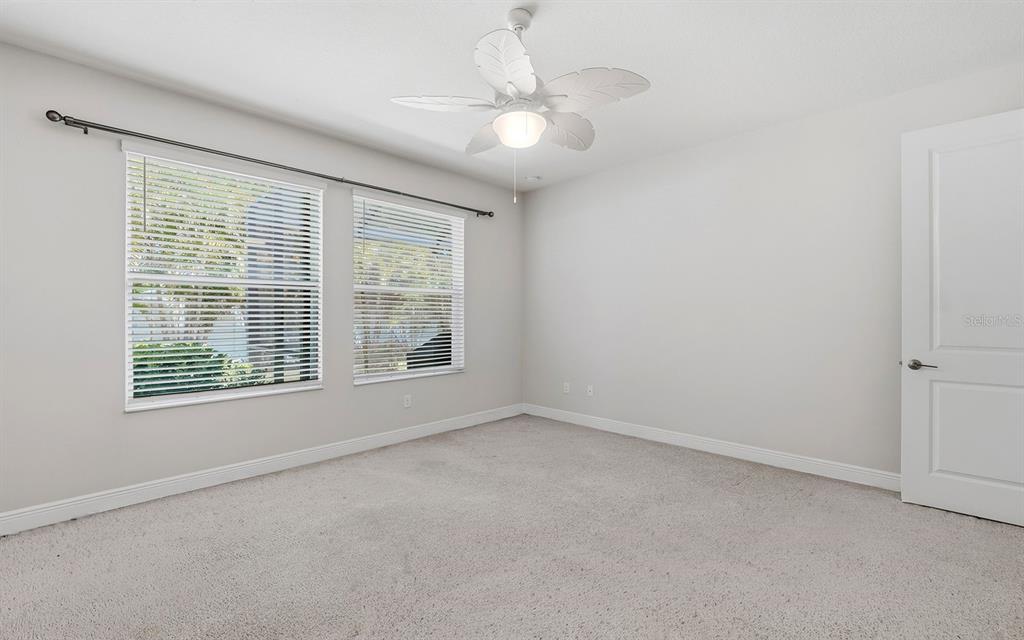 2535 Fireflag Lane Sarasota, FL 34232 - Photo 16 of 27 a view of an empty room with a window
