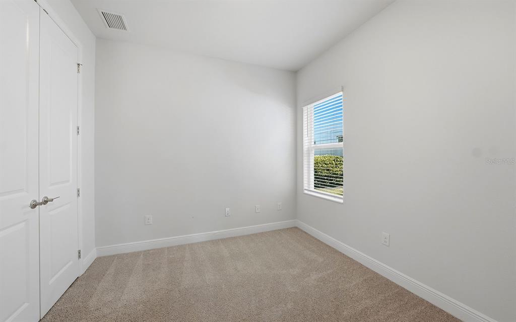 2535 Fireflag Lane Sarasota, FL 34232 - Photo 17 of 27 a view of an empty room with a window