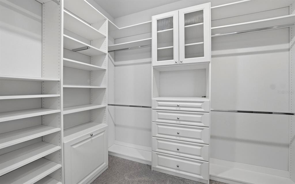 2535 Fireflag Lane Sarasota, FL 34232 - Photo 19 of 27 a view of walk in closet with empty racks