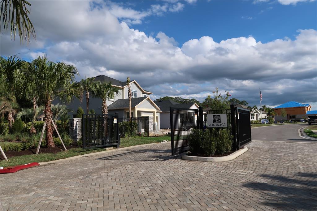 2535 Fireflag Lane Sarasota, FL 34232 - Photo 3 of 17 a view of a house with a yard