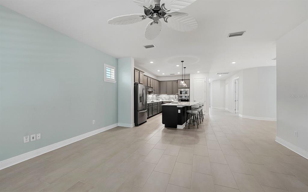 2535 Fireflag Lane Sarasota, FL 34232 - Photo 9 of 27 a view of a kitchen with a sink and a chandelier fan